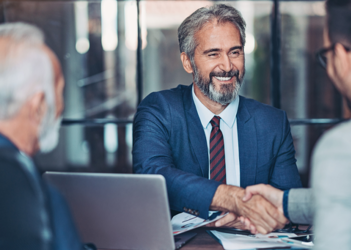 man-shaking-hand-with-business-banking-advisor