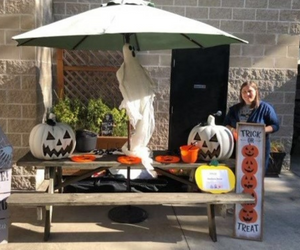 Person standing at Halloween table