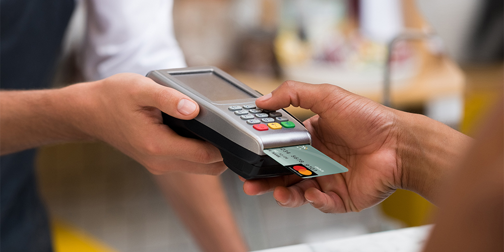 Customer using credit card machine