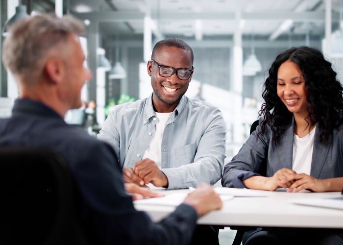 People talking to a banker at a bank