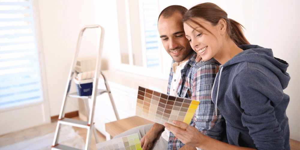 Couple looking at paint colors